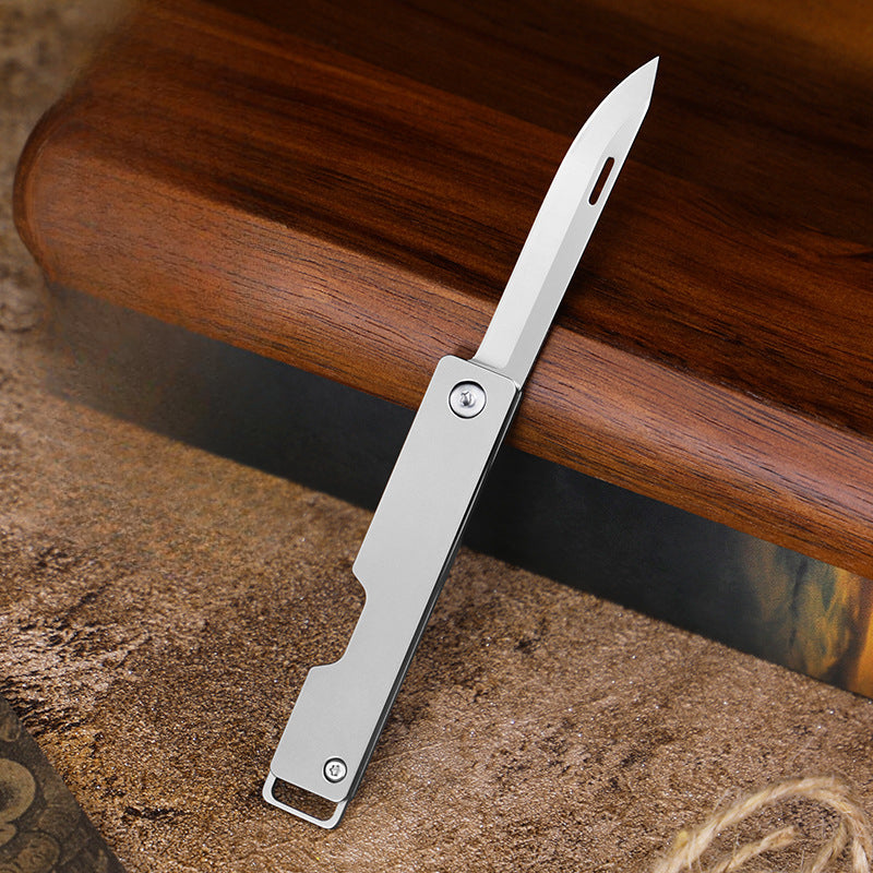 Compact Titanium Folding Knife for Outdoor Adventures and Keychain Use