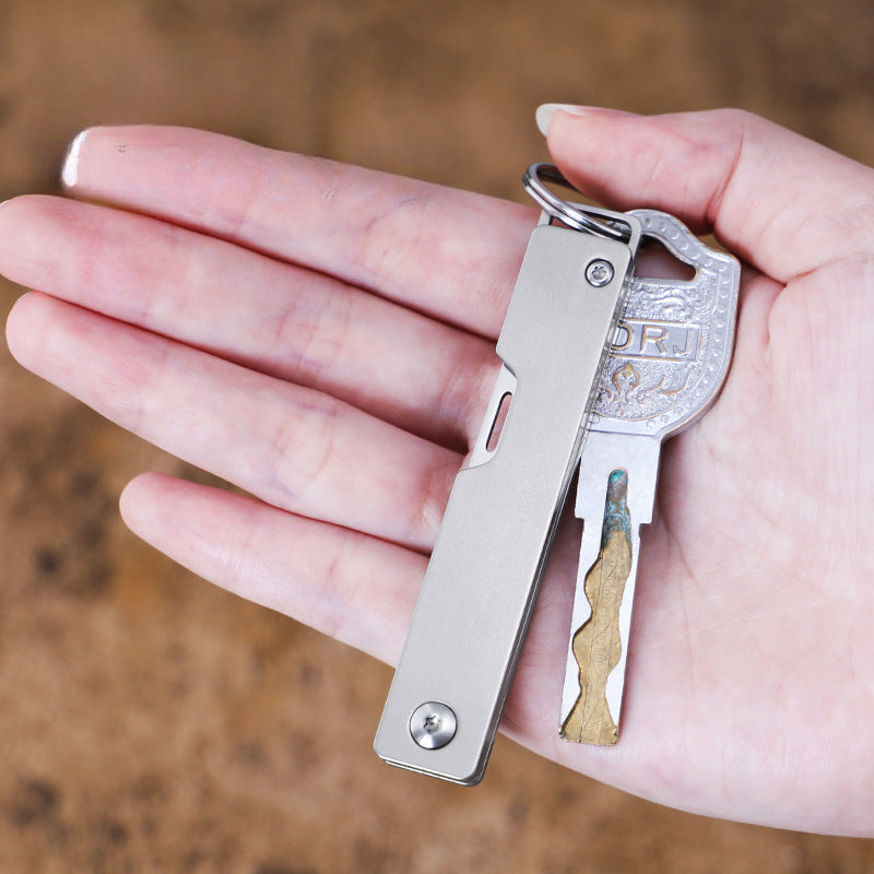 Compact Titanium Folding Knife for Outdoor Adventures and Keychain Use