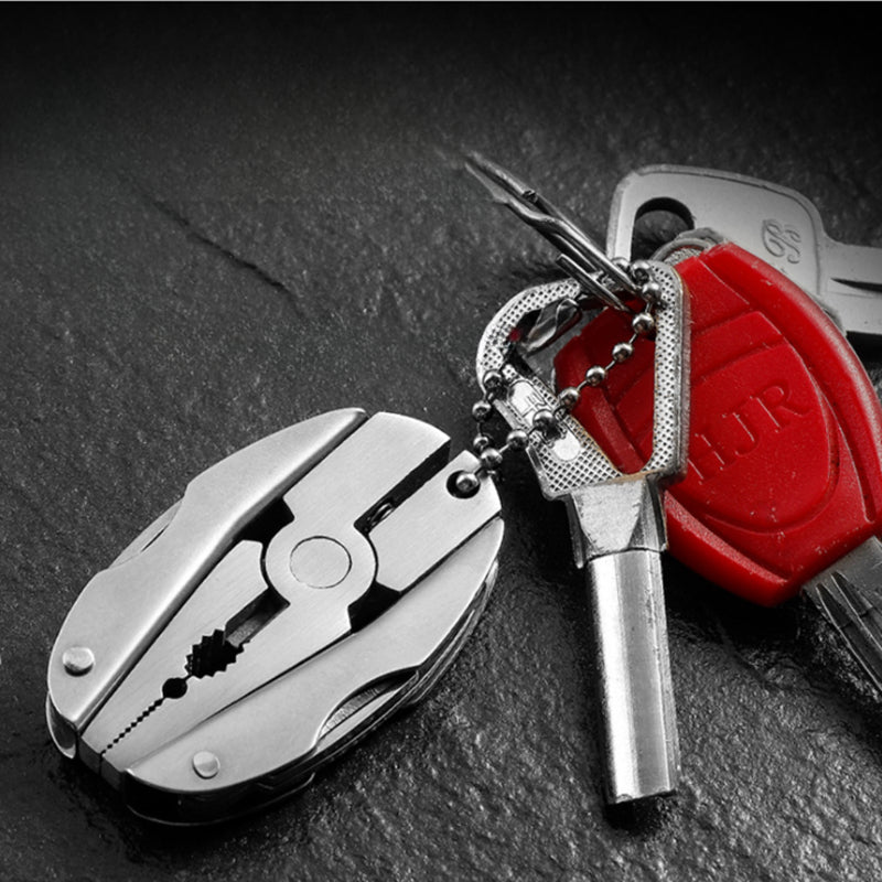 Versatile Scarab Shell Multi-Tool with Integrated Folding Mini-Plier