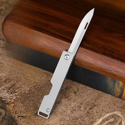 Compact Titanium Folding Knife for Outdoor Adventures and Keychain Use